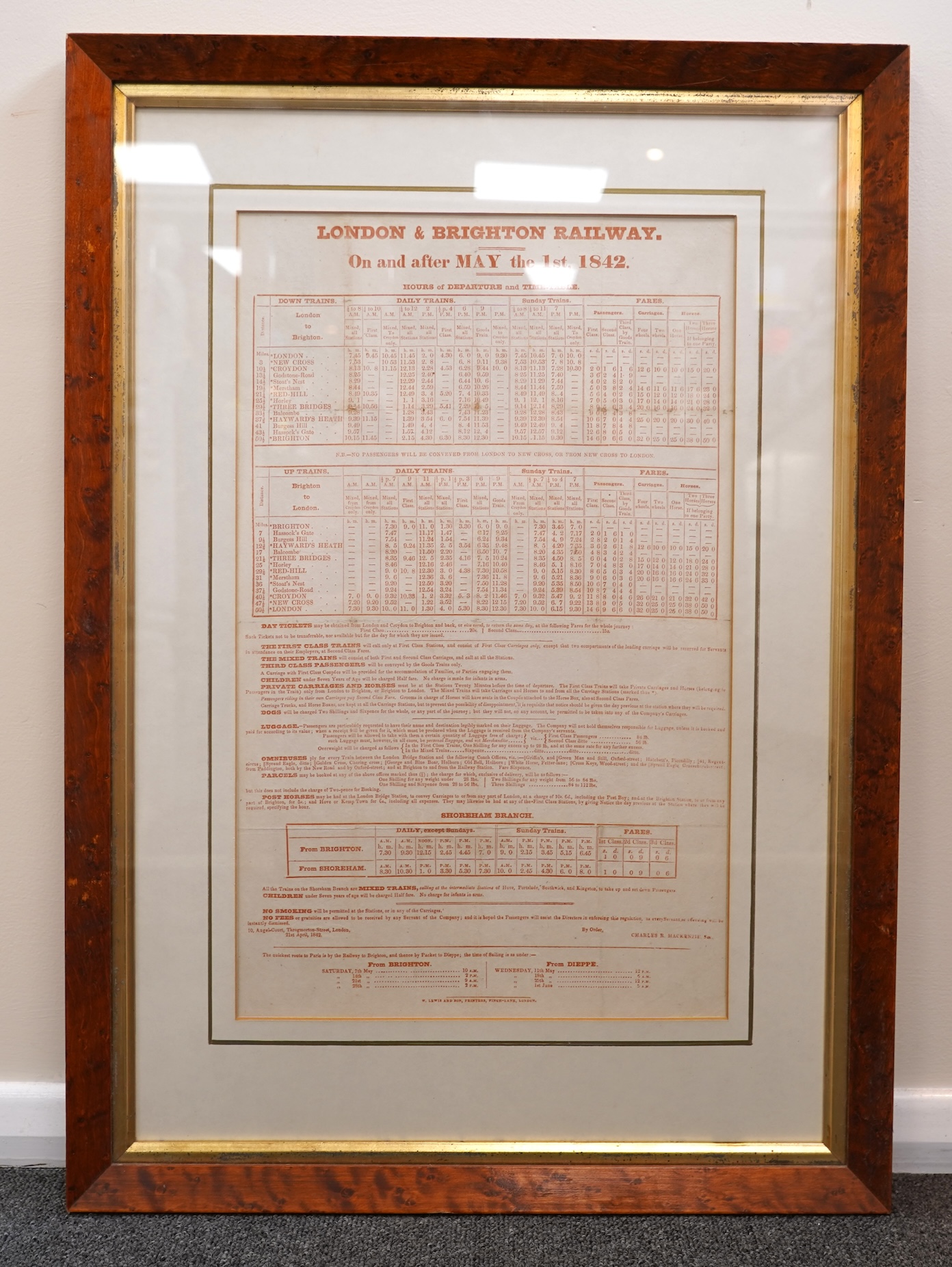 A framed London and Brighton railway timetable ‘On and after May the 1st, 1842’ including the Shoreham branch line at the bottom of the page, in a walnut frame, dimensions of the frame 62 x 44cm